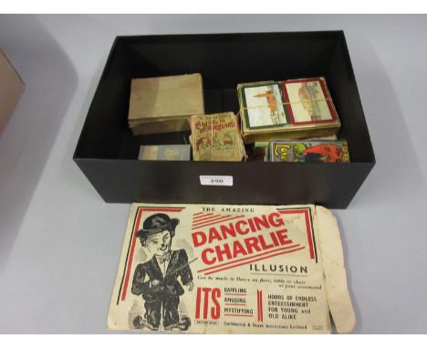 ' Dancing Charlie ' cardboard puppet in original envelope together with a quantity of various card games 