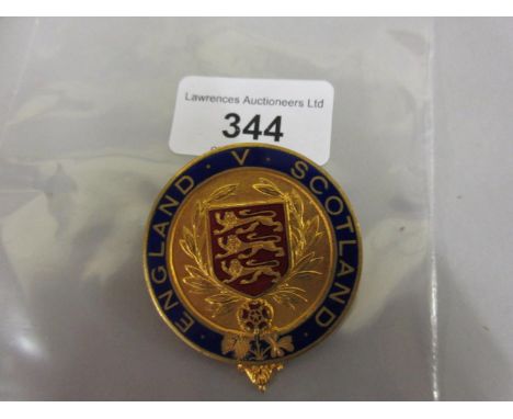 Circular gilt metal and enamel England V Scotland badge 