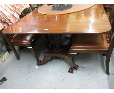 George IV style mahogany three pillar dining table on turned supports with platform bases and scroll feet with two extra leav