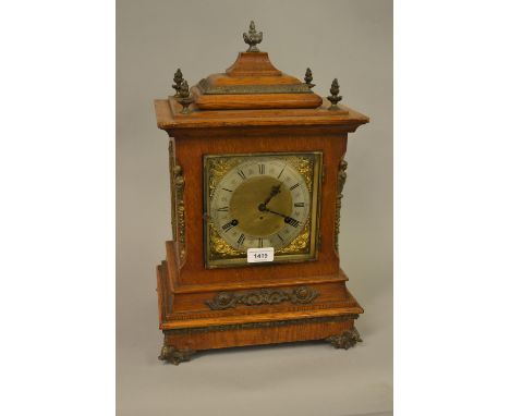 Late 19th Century German oak gilt metal mounted bracket clock, the silvered and gilded dial with Arabic numerals, with a two 