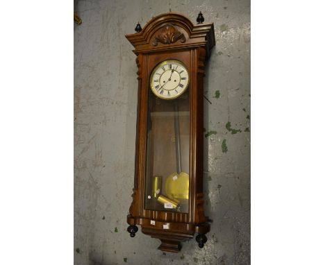 Early 20th Century Continental walnut Vienna wall clock, the enamel dial with Roman numerals, the two train weight driven mov