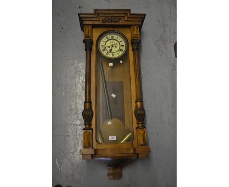 19th Century Continental walnut cased Vienna wall clock, the enamel dial with Roman numerals, 39.5ins high 