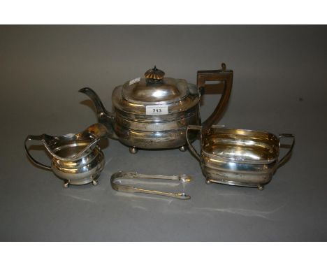 George III London silver teapot with boxwood handles, makers mark I.C., together with a similar George III two handled sugar 