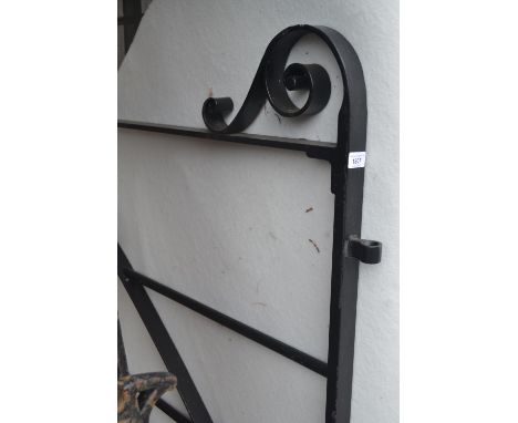 Modern good quality black painted wrought iron double gate having scroll work detailing and integral latch, 66ins high, 114in