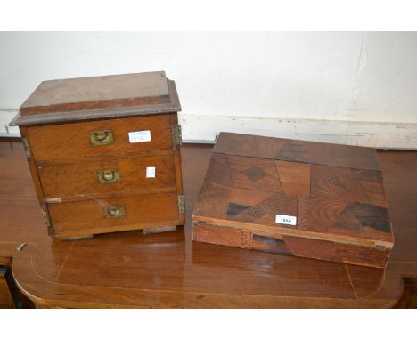 Japanese parquetry inlaid writing slope together with an oak three drawer table cabinet (both for restoration) 