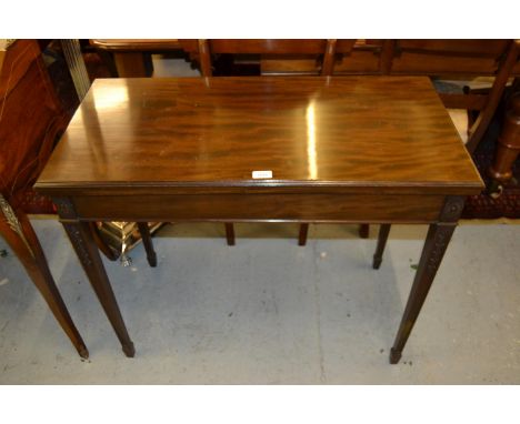 Edwardian rectangular mahogany fold-over card table on square tapering supports and spade feet 