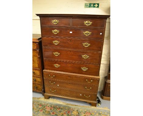 George III mahogany tallboy, the moulded dentil cornice above two short and four long graduated drawers, the base with a furt