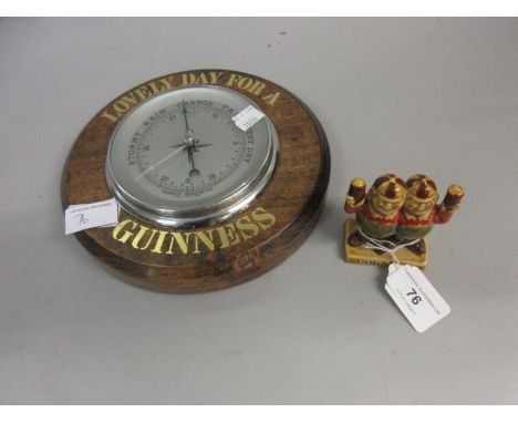Wade Guinness porcelain advertising figure, Tweedledum and Tweedledee, together with a Guinness advertising barometer 