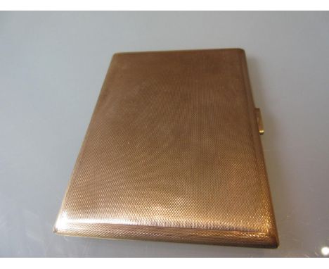 Rectangular 9ct gold cigarette case with engine turned decoration 