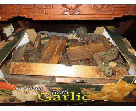 Collection of various woodworking planes and tools 