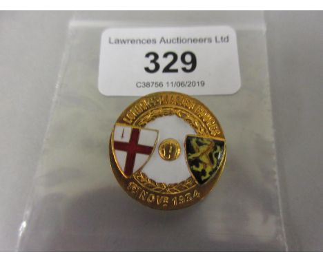 Circular gilt metal and enamel London V Diables Rouges, 1934 button hole badge 