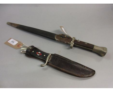 German Hitler Youth knife in leather sheath, with a chrome wooden and steel grip with enamel badge and blade inscribed Karl S