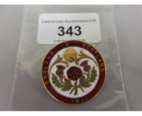 Circular gilt metal and enamel England V Scotland 1911 badge 