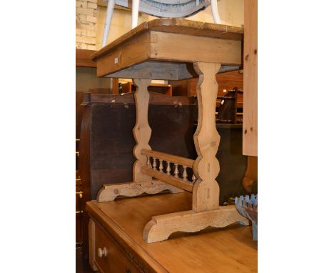 19th Century Continental stripped and polished pine side table with a shaped top on shaped end supports with stretcher 