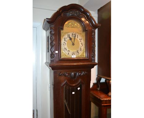 Early 20th Century mahogany longcase clock, the shaped broken arch hood above a bevelled glass door and conforming plinth bas