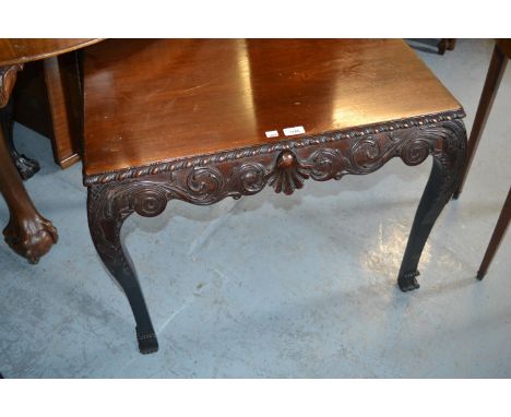 Irish rectangular mahogany table with carved shaped frieze raised on cabriole supports 