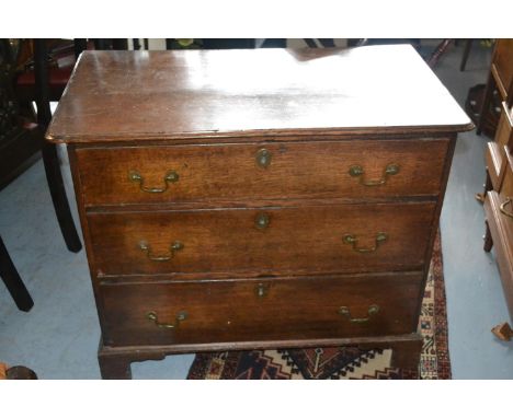 George III oak chest, the moulded top above three drawers with brass swan neck handles and escutcheons on bracket feet, 34.5i