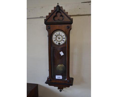 Late 19th Century miniature walnut Vienna wall clock, the enamel dial with Roman numerals and a single train movement 