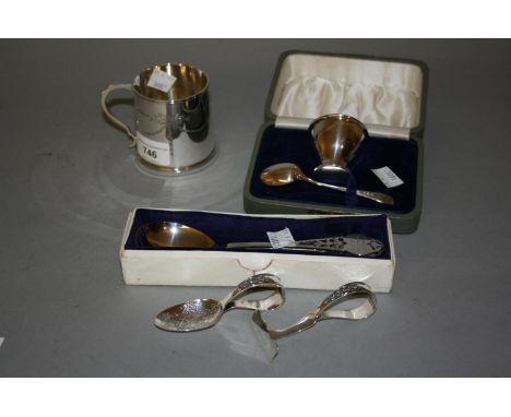 Birmingham silver Christening mug, 1919, together with a cased silver eggcup and spoon, silver Christening pair, decorated wi