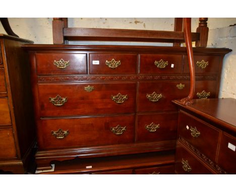 Pair of 20th Century faux wood chests of eight drawers on ogee bracket feet, 54ins wide x 18ins deep x 32ins high, together w