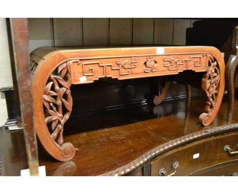 20th Century Chinese hardwood coffee table with pierced scroll ends together with a brass inlaid octagonal table on a folding