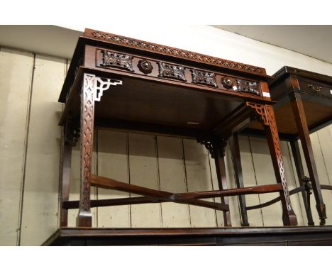 Reproduction mahogany silver table with a galleried top above a long drawer raised on blind fretted supports 