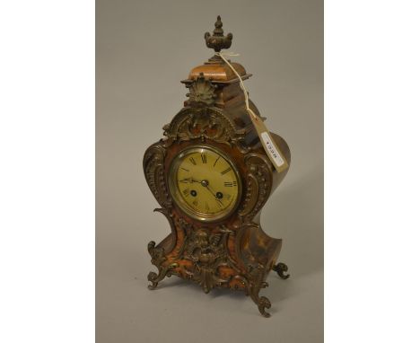 Small late 19th Century French beechwood and figured walnut two train mantel clock with patinated metal mounts, the gilt dial