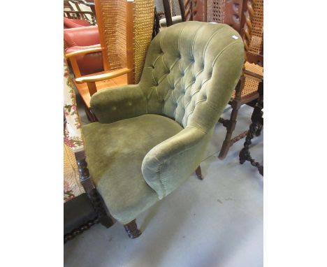 19th Century button upholstered armchair having green  upholstery on ring turned supports with brass casters 