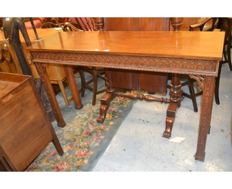 Reproduction mahogany serving table with a blind fretted and gadroon frieze raised on square blind fretted and chamfered supp