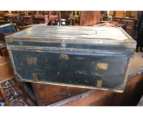19th Century leather brass mounted and studded trunk, the hinged lid enclosing a camphor lined interior, 36.5ins wide 