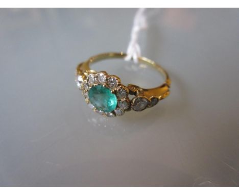 18ct Yellow gold flower head ring set emerald and diamonds 