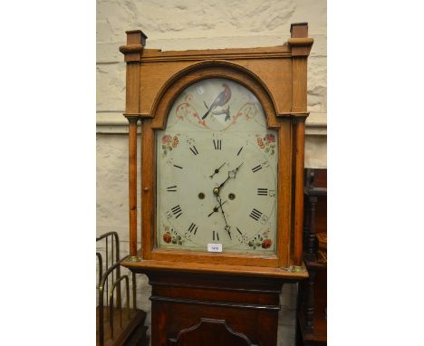 Oak longcase clock having a painted dial and two train eight day movement 