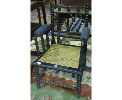 A Morris & Co style ebonised bobbin turned chair