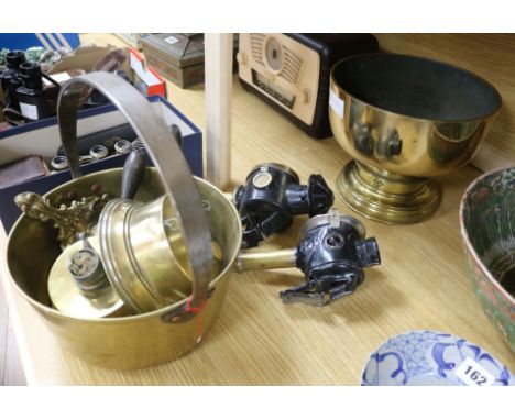 A brass jam pan, planter, two lamps, a holder and a pair of lamps