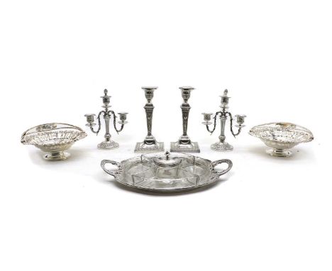 A large quantity of Victorian and later silver plated tablewares,to include a pair of Adam revival neo-classical candlesticks