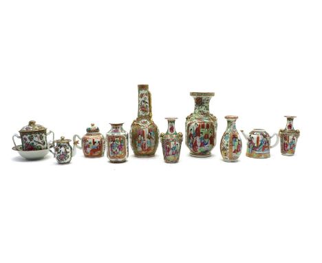 A collection of Chinese Canton enamelled famille rose,19th century, comprising six vases, three teapots, one sugar jar and a 