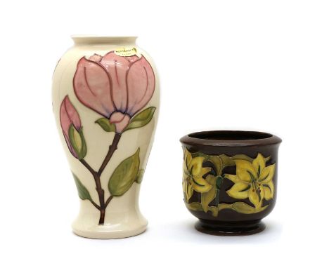 A Moorcroft pottery ‘Magnolia’ pattern vase, of waisted form, with impressed marks, 26cm high together with a ‘Bermuda Lily’ 