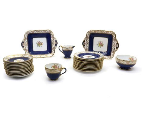 A Copeland Spode 'Regent' pattern tea service,hand decorated on a powder blue ground and gilt border, for eleven place settin