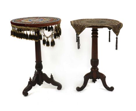 Two mahogany lamp tables,19th century, one with an octagonal top, the other with a circular beadwork top, each raised on turn