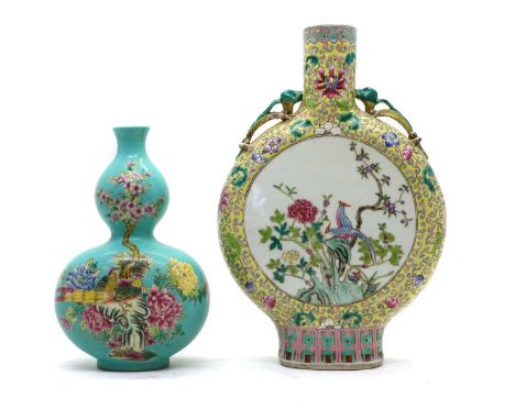 Two Chinese famille rose vases,20th century, comprising: one in double gourd form, painted with pheasants on rocks below a bl