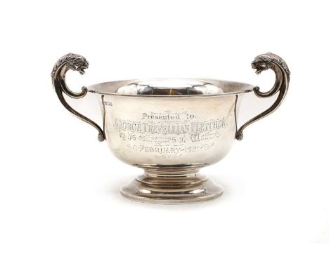 A silver twin handled pedestal cup  by Robert Pringle &amp; Sons, London, 1920, of plain form, with raised lion capped harp h