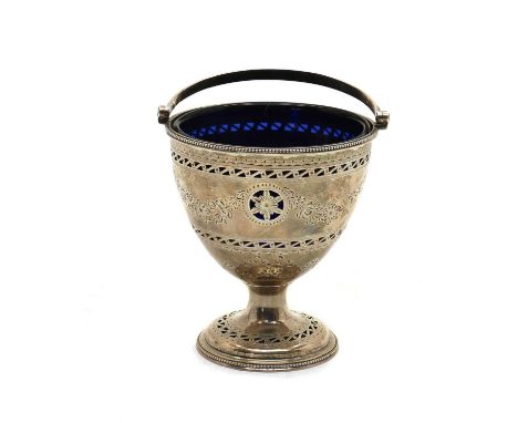 A George III silver swing-handled sugar bowl, maker’s mark R H, London 1784, with pierced and engraved swag decoration, leadi