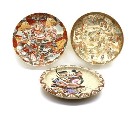 A Japanese Satsuma ware charger,Meiji period (1868-1912), painted with figures in shaped panels, 37cm diametertogether with t