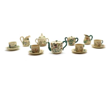 A collection of Japanese Satsuma tea wares, early 20th century, comprising: a teapot, a sugar bowl, a milk jug, six teacups, 