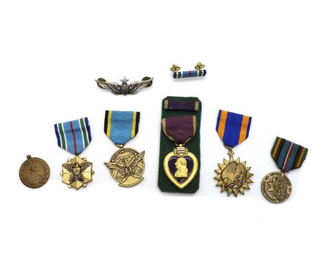 A collection of seven WWII medals, comprising The Africa Star, The Italy Star, The 1939-1945 Star, and four 1939-1945 War Med