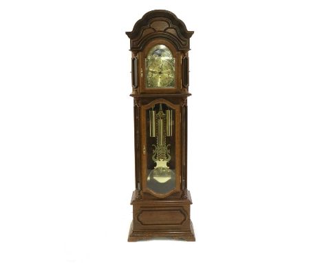 An oak longcase clock, of recent manufacture, the arched moon phase dial, enclosing a three train movement, striking on gongs