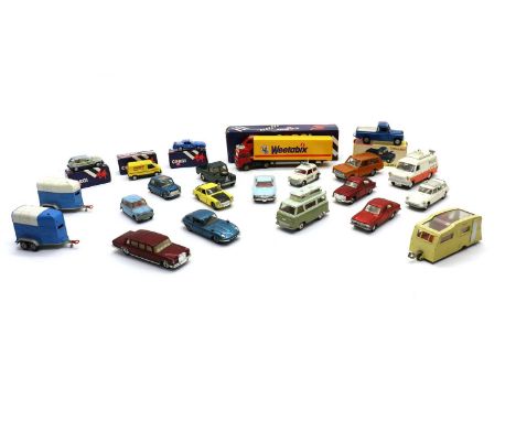 A collection of eight Dinky Toys, comprising a boxed ‘Land Rover’, another unboxed example, a Ford Transit Van marked ‘Police