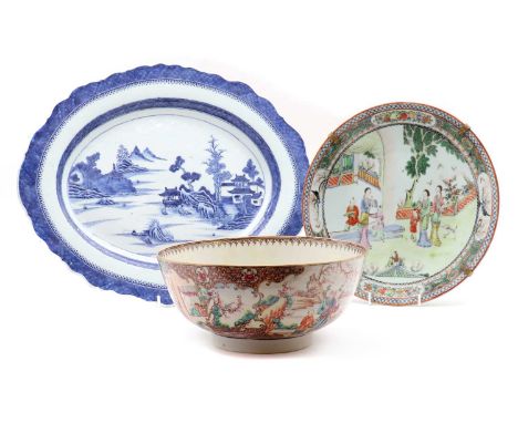 A Chinese famille rose punch bowl,18th century, the rounded sides rising from a circular foot, painted with figures in a gard