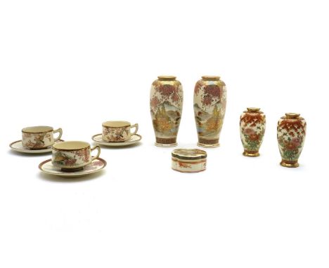 A collection of Japanese Satsuma wares, Meiji period (1868-1912), comprising three teacups and saucers, a lobed box and cover