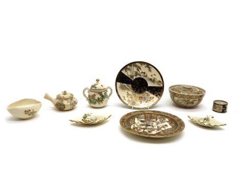 A collection of Japanese Satsuma ware, 19th to 20th century, including a teapot, a sugar bowl, a bowl and cover, a napkin rin